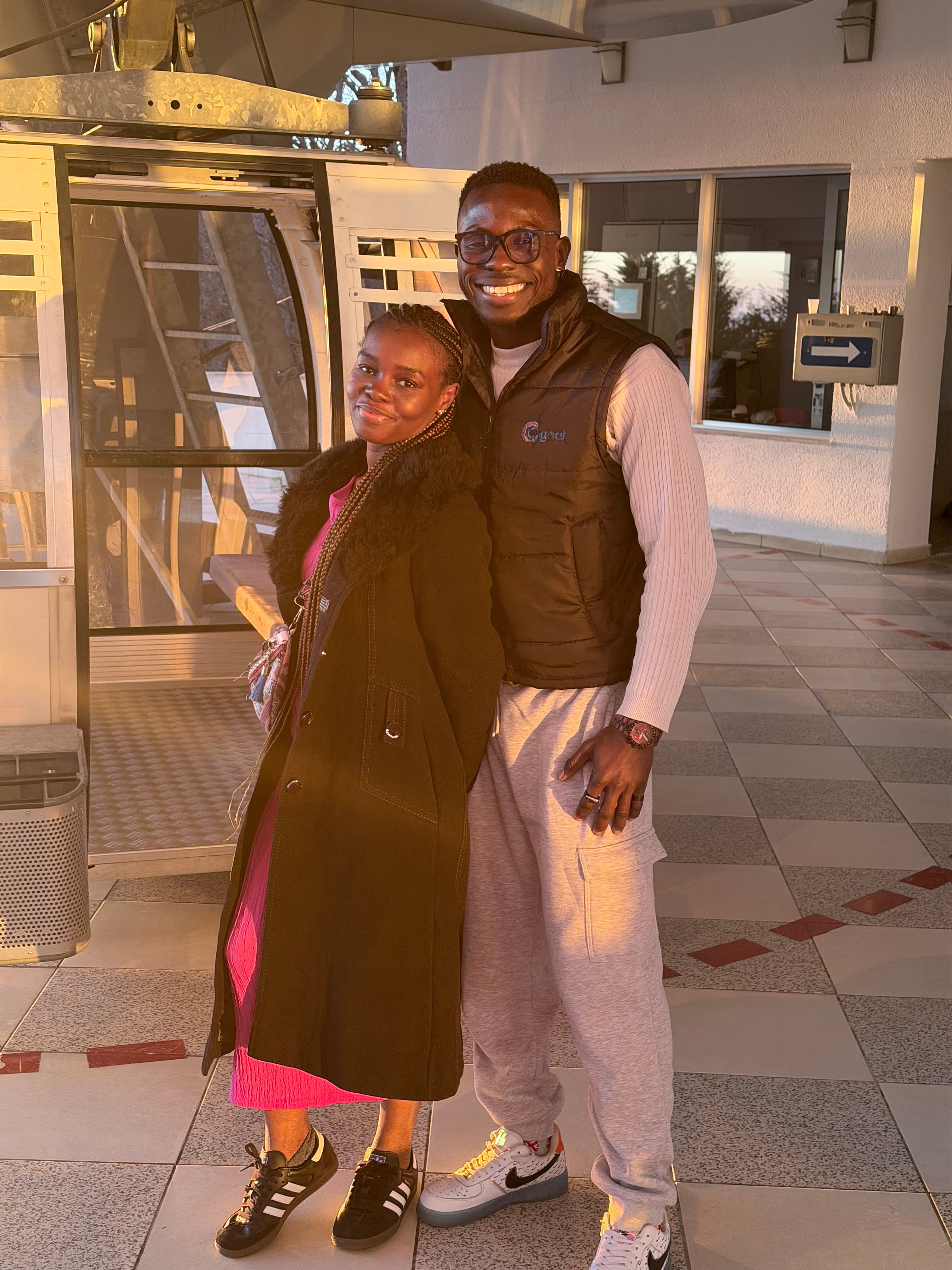 Close-up selfie of Ayo and Ola smiling outdoors