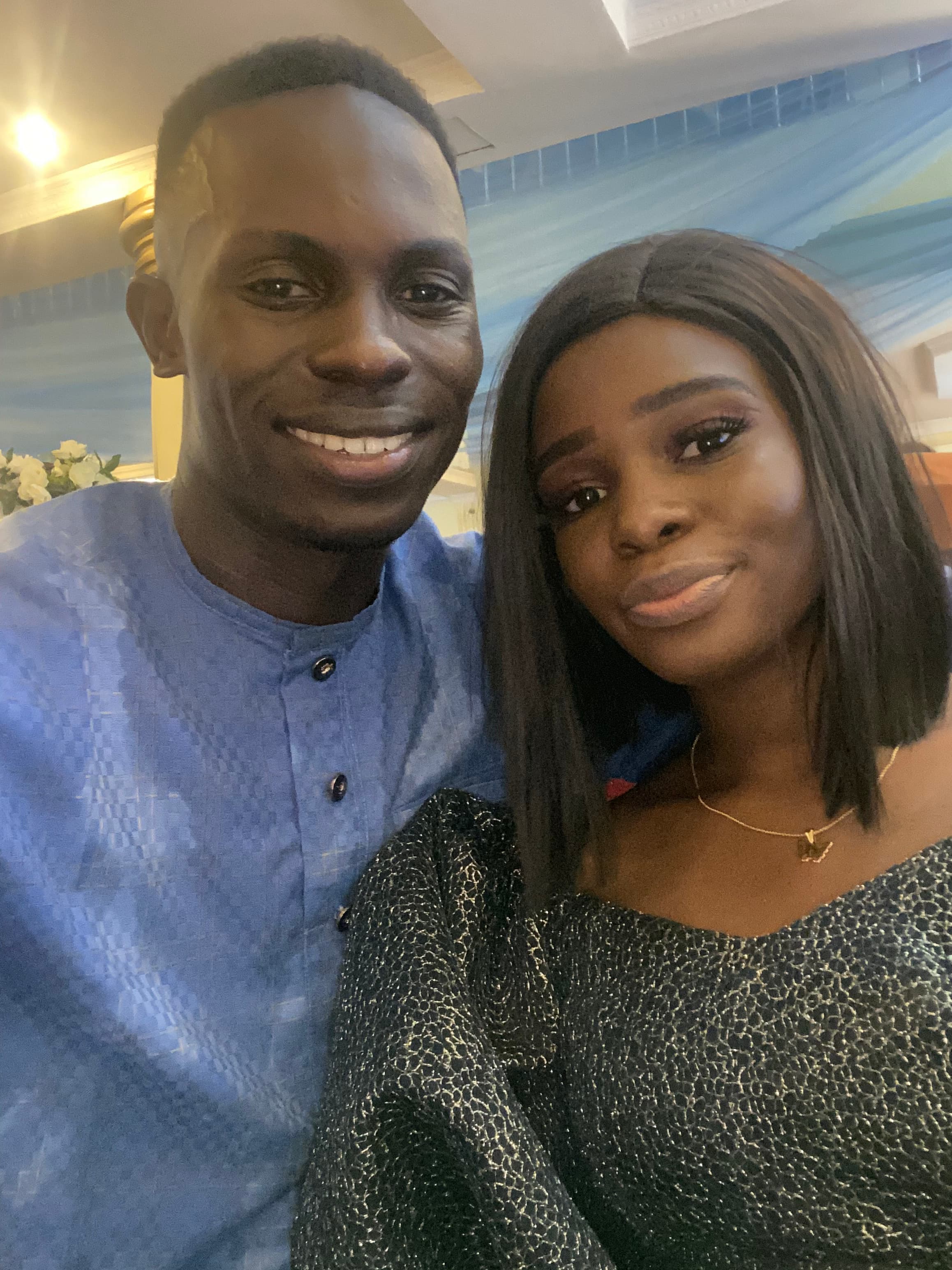 Ayo and Ola smiling together at an event